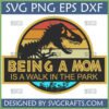 Funny Mom Life Jurassic Park SVG with T-Rex skeleton and retro sunset, 'Being a Mom is a Walk in the Park' text for Cricut and Silhouette