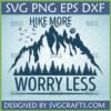 Hike More Worry Less SVG design featuring mountains, pine trees, flying birds, and a bear paw print, suitable for Cricut and Silhouette.