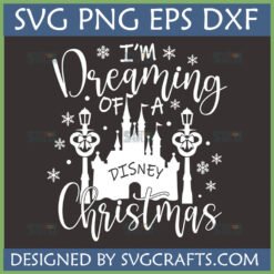 Dreaming of Disney Christmas SVG digital design featuring a white castle, lampposts, and snowflakes on a dark background.