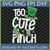 St Patrick's Day 'Too Cute To Pinch' SVG design with smiling leprechaun hat and shamrocks on a dark green background.