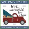 Vintage red pickup truck carrying a Christmas tree and gifts with 'It's the most wonderful time of the year' text, a perfect Vintage Red Truck Christmas SVG.