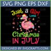 A cheerful pink flamingo wearing a Santa hat and wrapped in Christmas lights, with the text 'Just a Girl Who Loves Christmas In July' and various Christmas ornaments around it. This is a Christmas In July Flamingo SVG design.