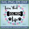 Livin' That Dog Mom Life SVG digital design with floral wreath, paw prints, and bone graphic, perfect for Cricut and sublimation crafts by SVGCrafts.