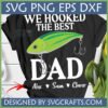 Black T-shirt with 'WE HOOKED THE BEST DAD' text and a green fishing lure graphic, personalized with names, 'We Hooked The Best Dad SVG'