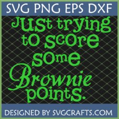 A bright green text design on a dark grid background that reads "Just trying to score some Brownie points." The text includes a mix of script and serif fonts. This is a Funny Brownie Points SVG design from SVGCrafts.